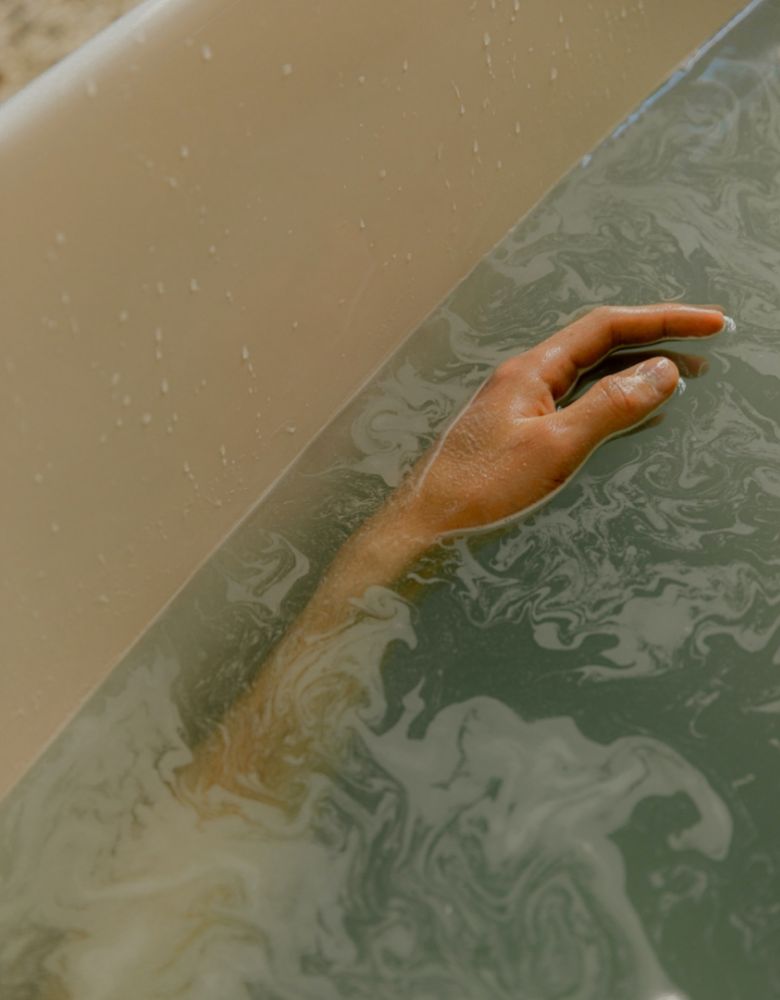 Close up of hand in hot tub water