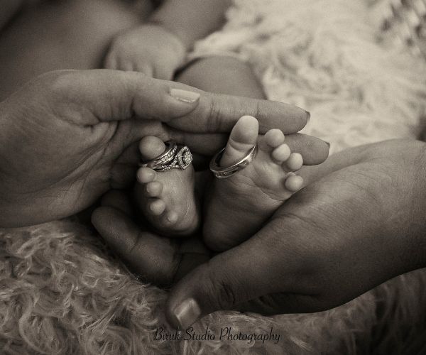 biruk studio photography of newborn feet with wedding rings